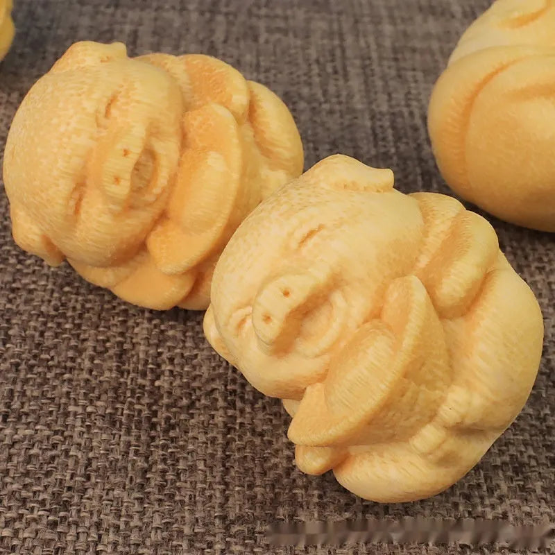 Solid bamboo carving ornament with cute pig design measuring 4cm tall by 3.5cm diameter
