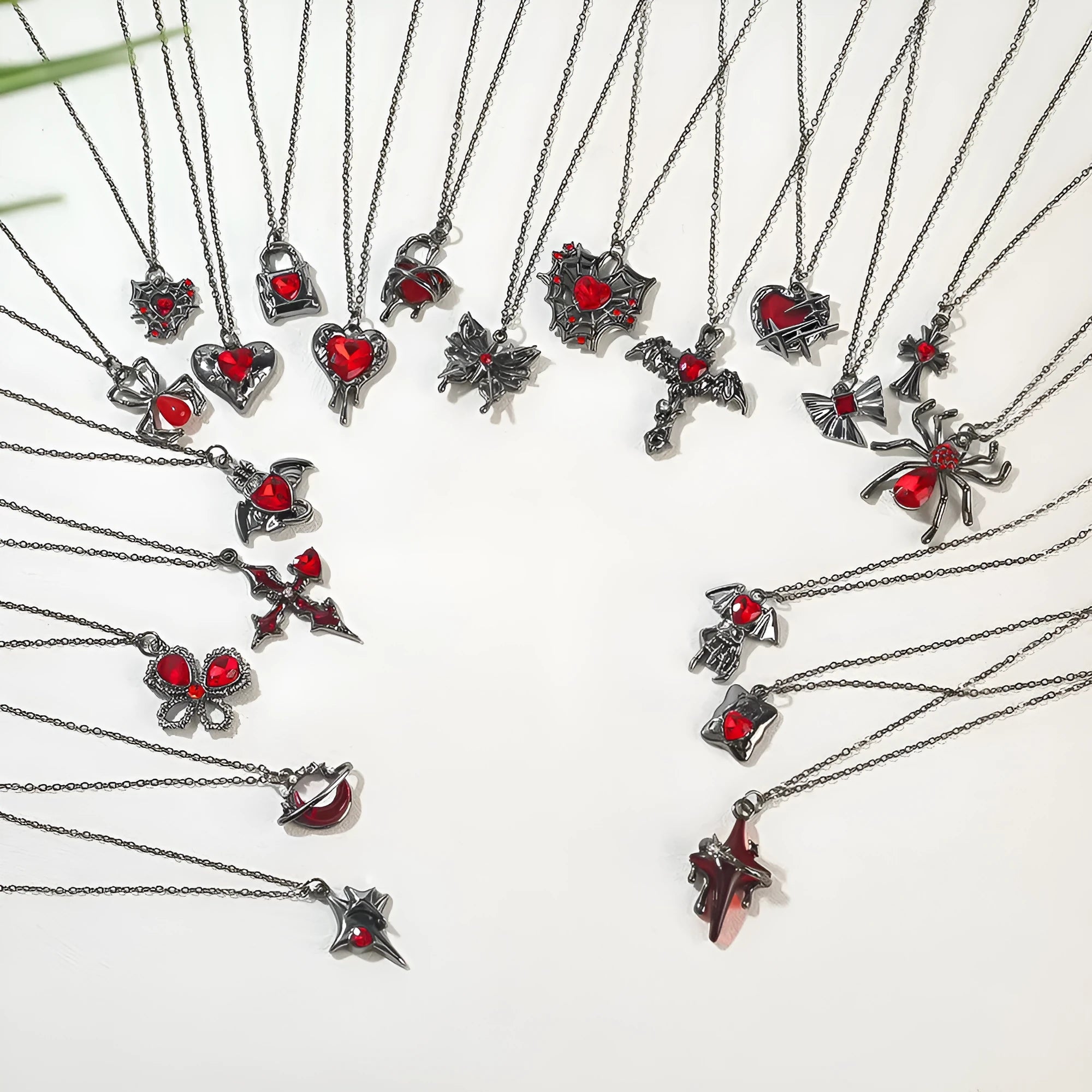 Dark Halloween necklace with bat and spider pendant designs on regular chain
