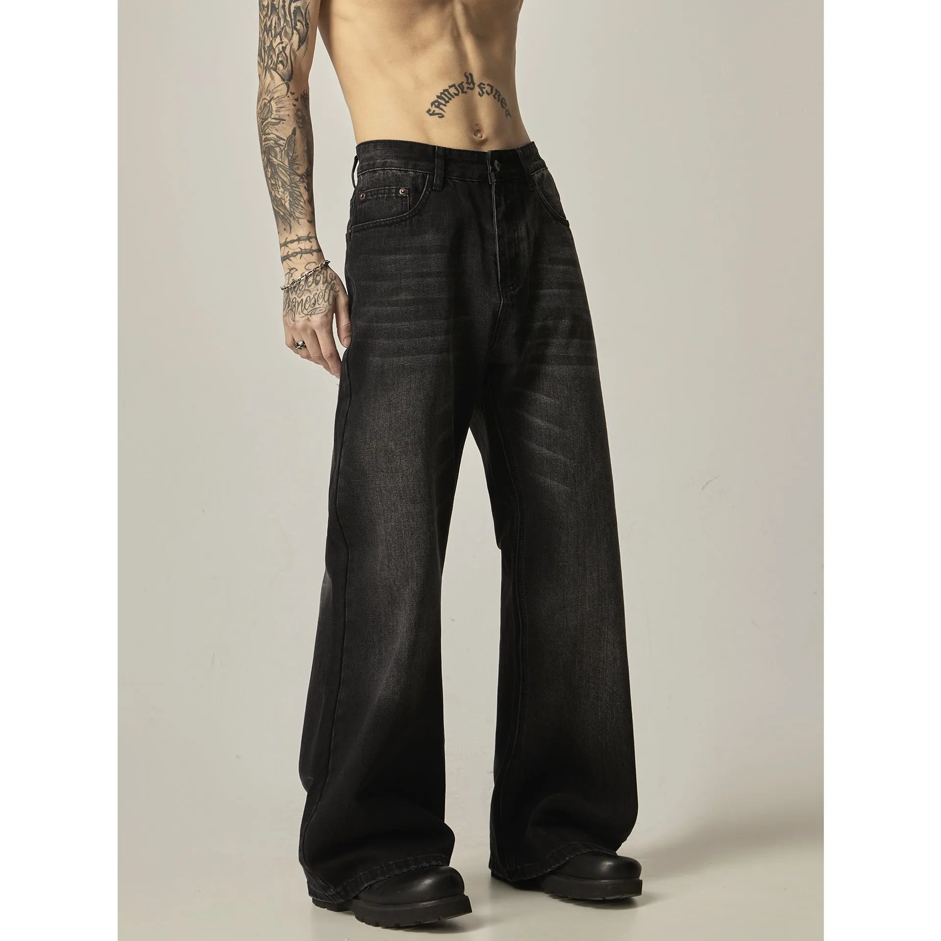 Black loose straight leg jeans with retro styling and zipper fly closure