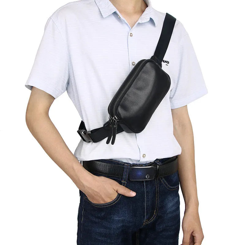 Small black cowhide leather crossbody bag for men with nylon lining.