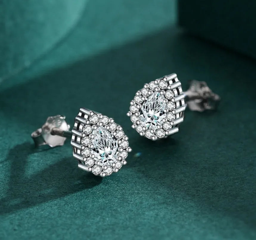 Silver drop shape ear studs made from 925 sterling silver with diamond-treated finish