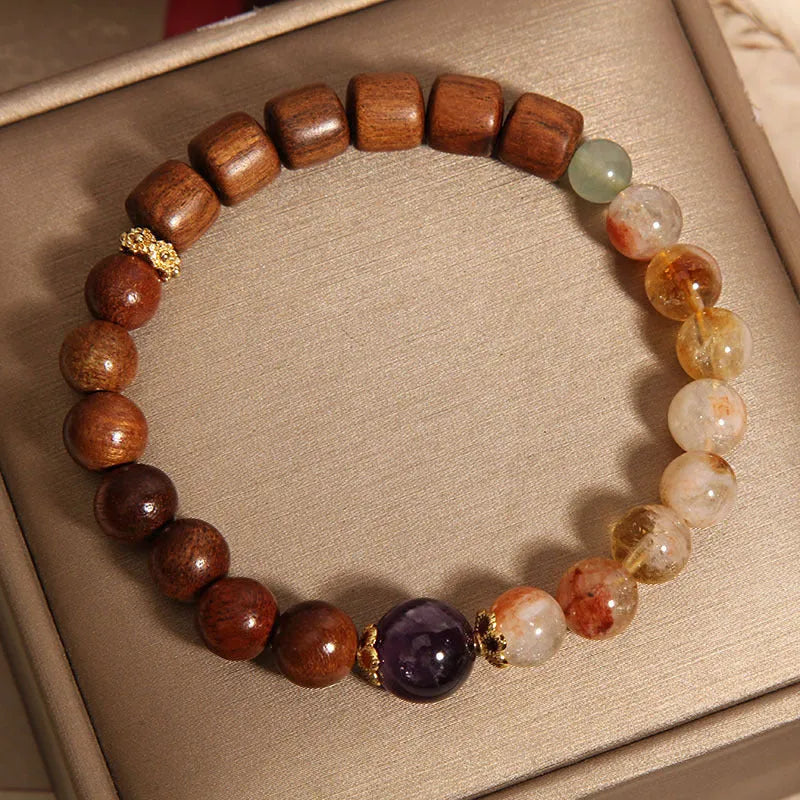 Women's bracelet in yellow tower crystal and amethyst tones with pearl and rhinestone decorative elements