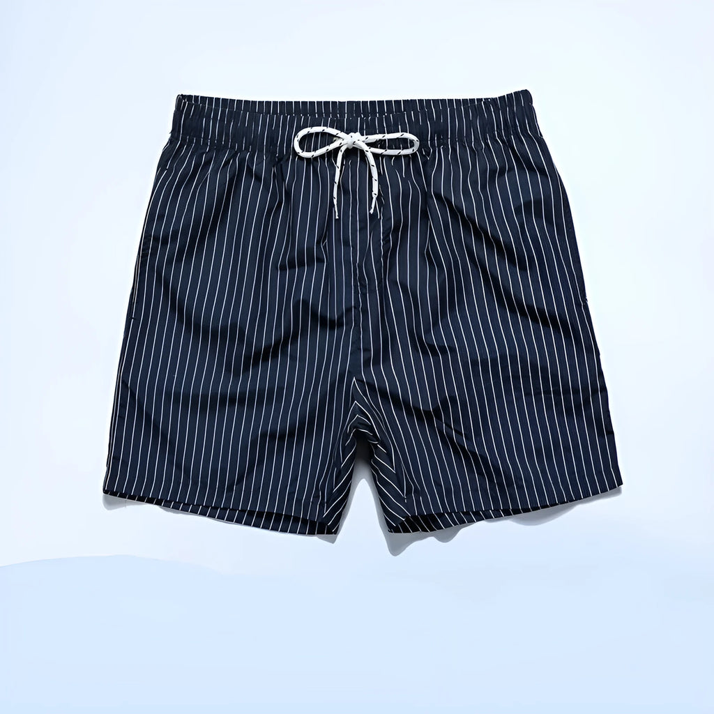 Men's navy blue polyester beach shorts with striped triangle lining and straight leg opening.