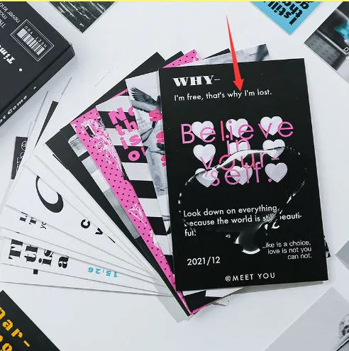 Box containing two different fresh-style postcards with printed messages.
