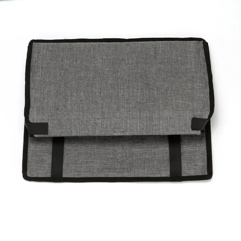 Foldable pet safety seat car bag in black Oxford cloth on a car seat with safety tether visible
