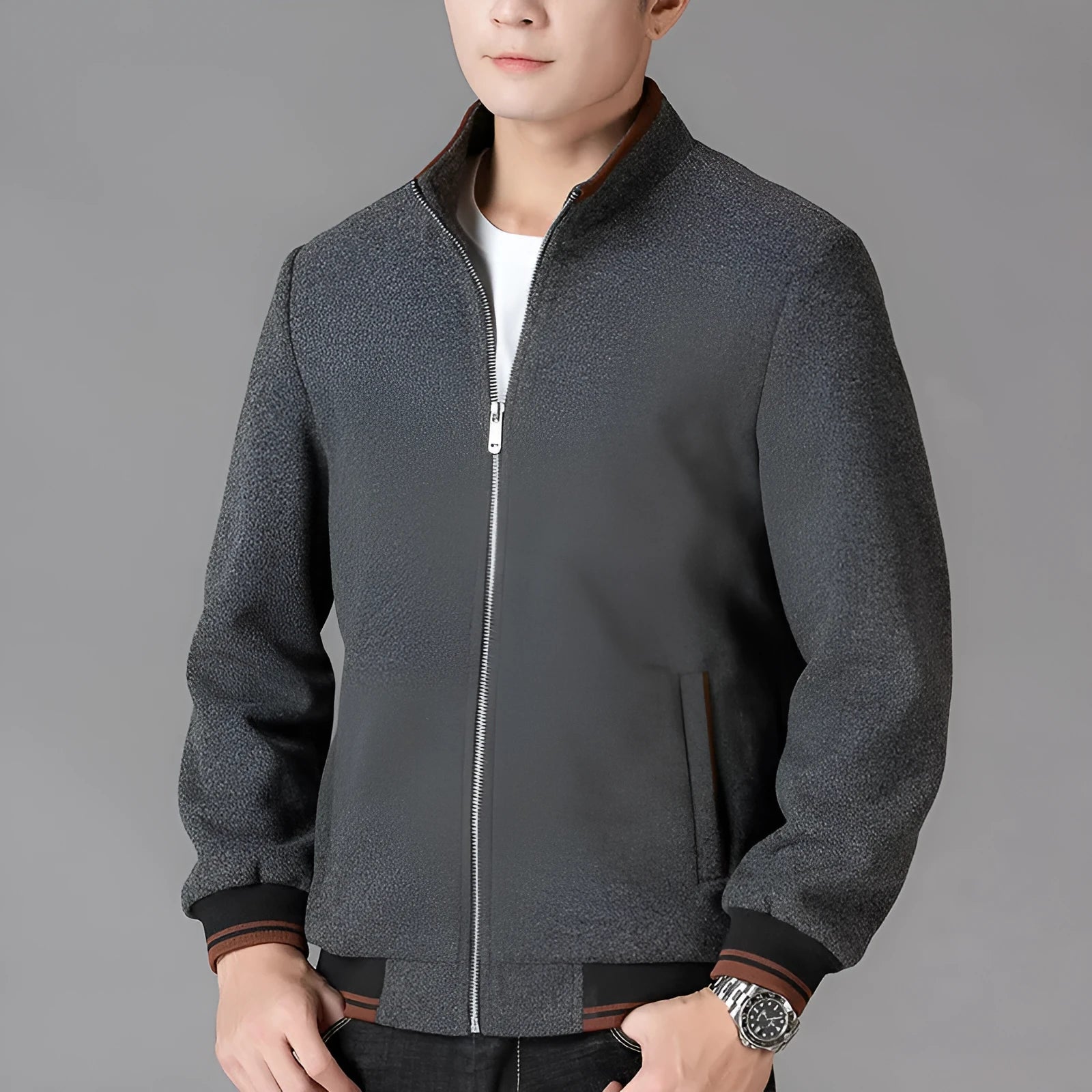 Men's grey sports-style fleece jacket with long sleeves and a side pocket.