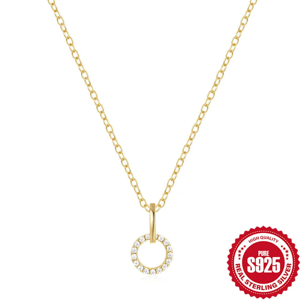 Gold-coloured geometric sterling silver pendant necklace with zircon detail on an adjustable chain.