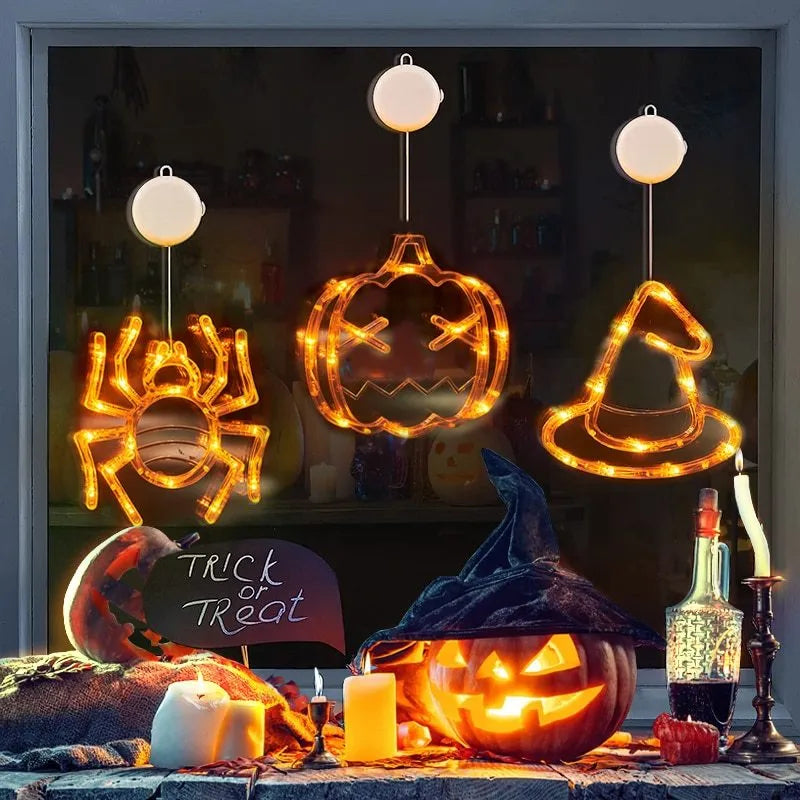 Seven Halloween LED hanging lights with spider, pumpkin and ghost designs featuring suction cups