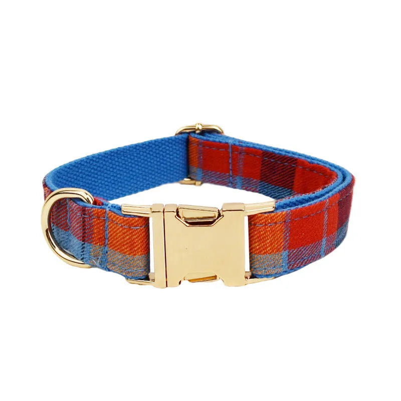 Blue velvet plaid dog collar with integrated hand-holding rope and leash set on cloth material