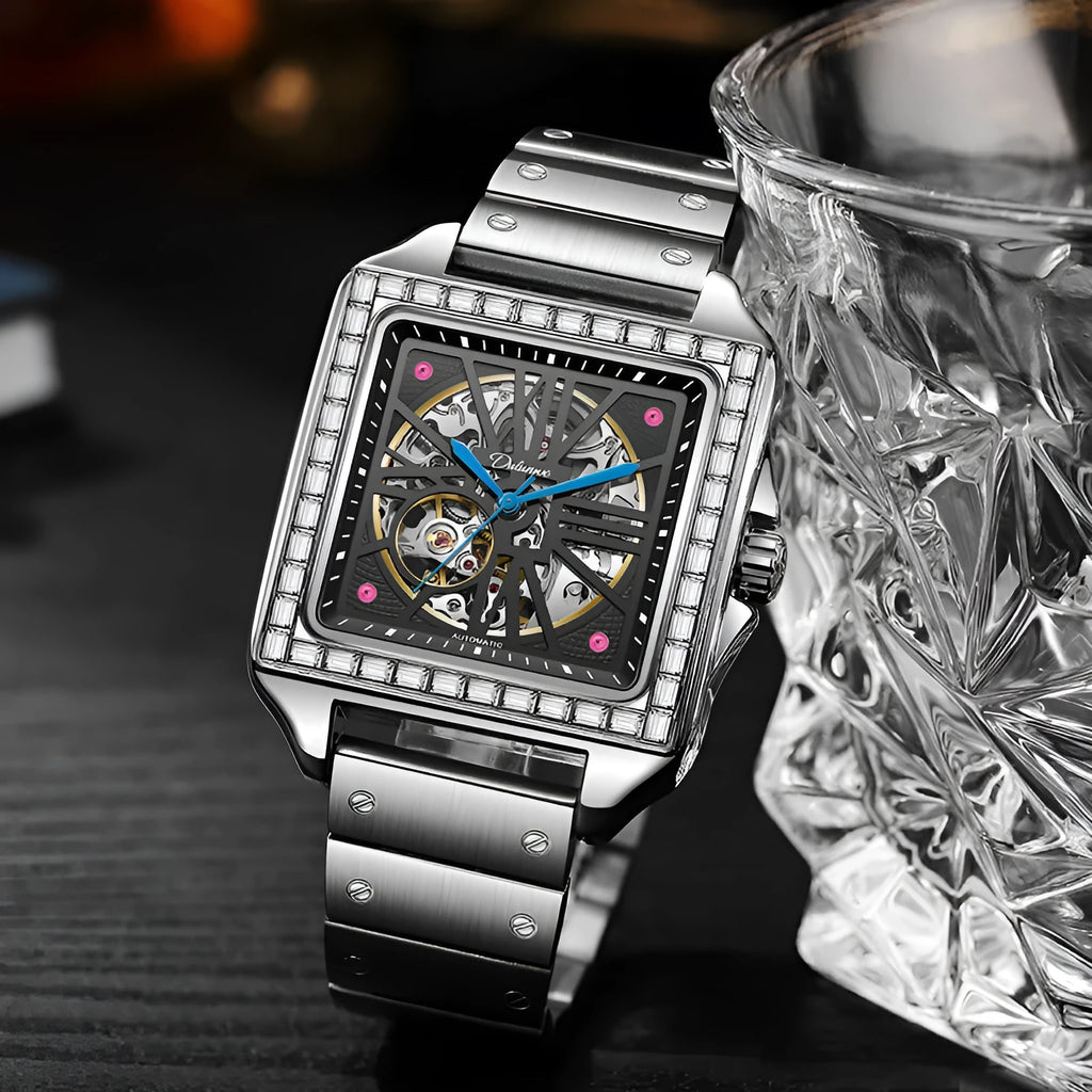 Men's square automatic watch with diamond studs on a black leather strap.