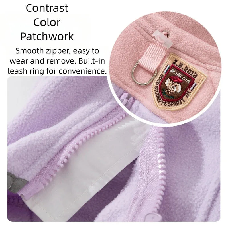Four-legged fleece jacket for cats and small dogs in colour block design with badge patch, showing front zipper and elastic cuffs.