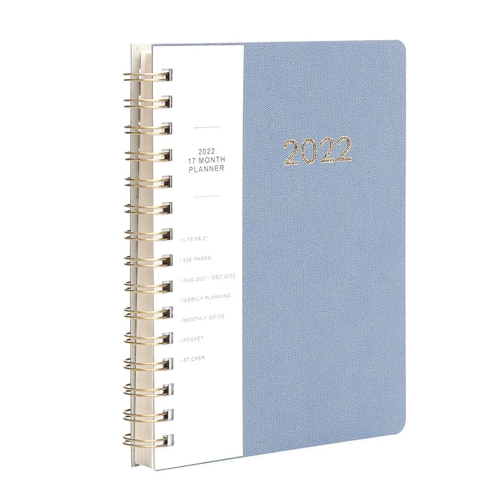 Green and blue 17-month 2022 student planner notebook with coil binding and pockets