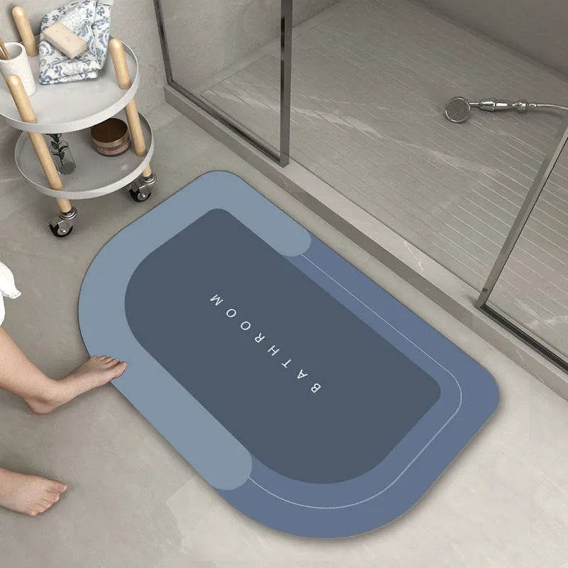 Blended material bathroom floor mat in oval and rectangle shapes on a tiled floor.