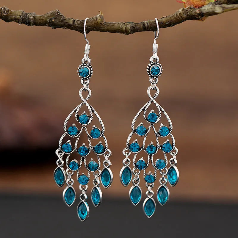 Retro long drop earrings with purple crystal fringes on an alloy setting.