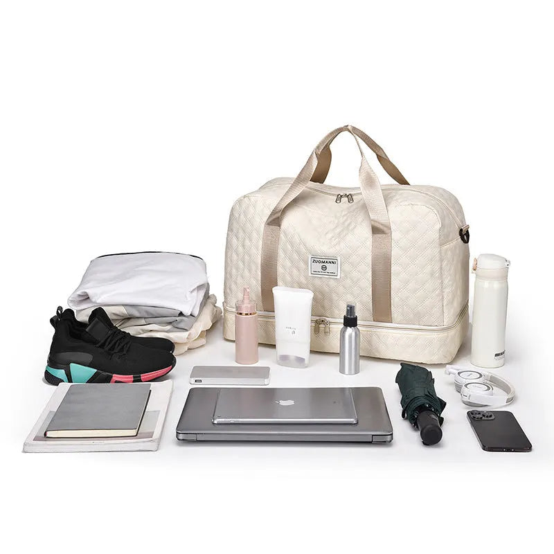 Large Oxford cloth travel bag in a solid colour with sewing thread details.