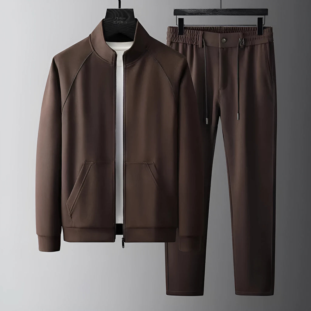 Men's slim fit stand collar tracksuit set in Vinylon fabric shown in black colour.