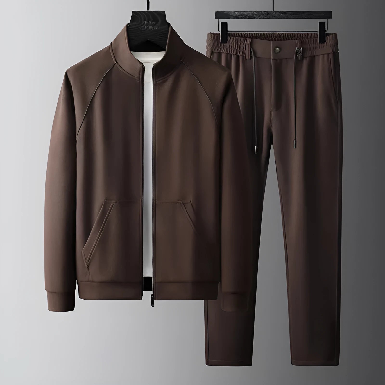 Men's slim fit stand collar tracksuit set in Vinylon fabric shown in black colour.
