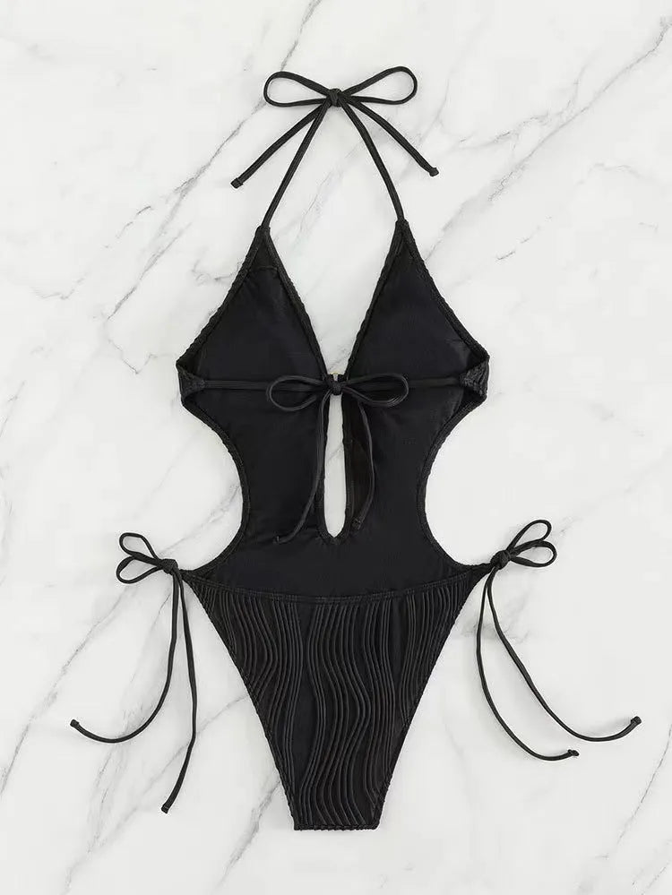 Women's black lace-up triangle bikini swimsuit with adjustable ties and solid colour design