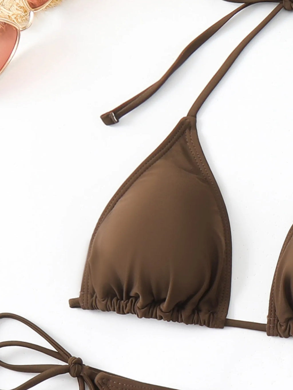 Women's brown three-piece swimsuit set with bra, shorts, and blouse made from nylon