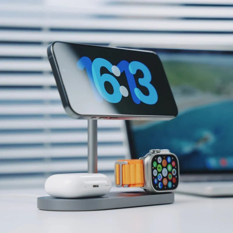 Three-in-one magnetic wireless charger with aluminium alloy body in gray finish, charging a smartphone and watch
