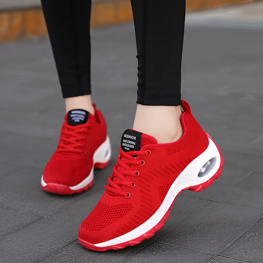 Women's red and black mesh lace-up sneakers with round toe and flat 3-5cm heel on a white background.