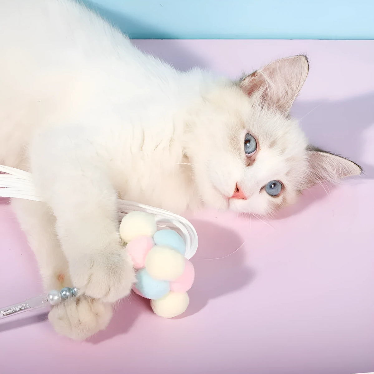 Acrylic cat fairy rod toy with colourful stripes, blue colour option, on white background