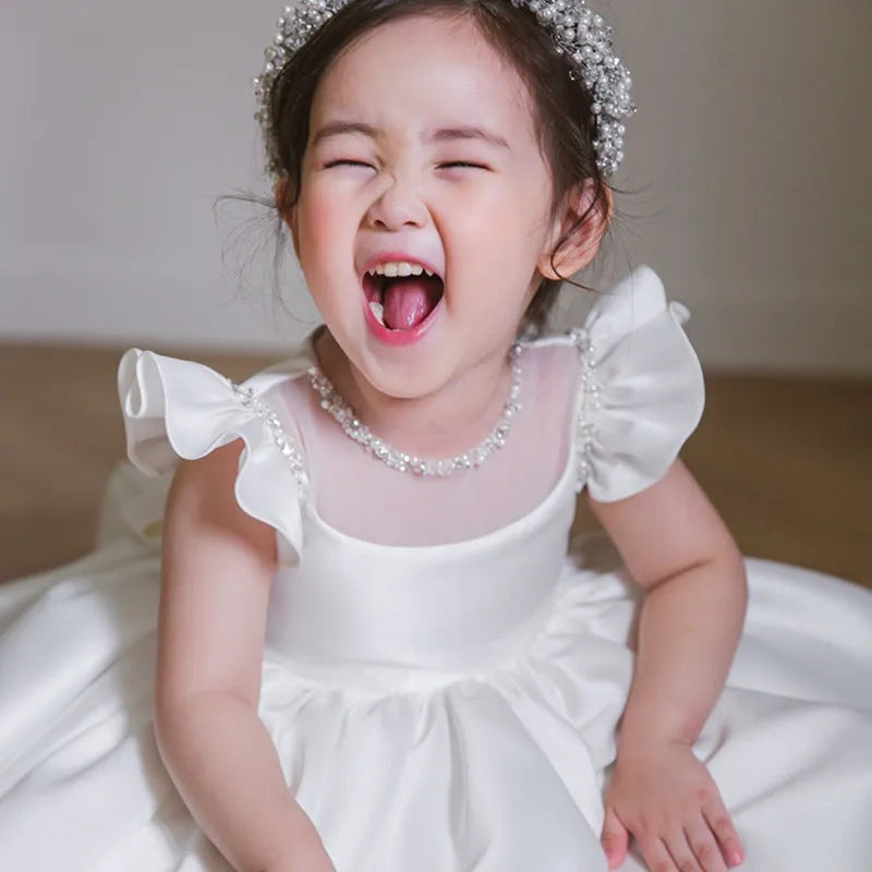 White satin princess dress for girls with puff sleeves, chemical fibre fabric, and flax lining on a white background