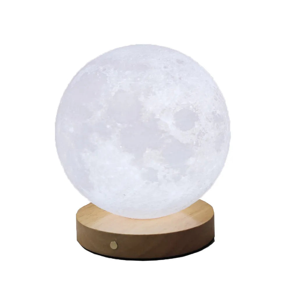 Rotating moon night lamp on a wooden base showing three colour light modes.