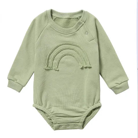 Baby wearing long sleeve waffle cotton romper with either cotton rope ties or button front closure in beige, khaki, green or blue