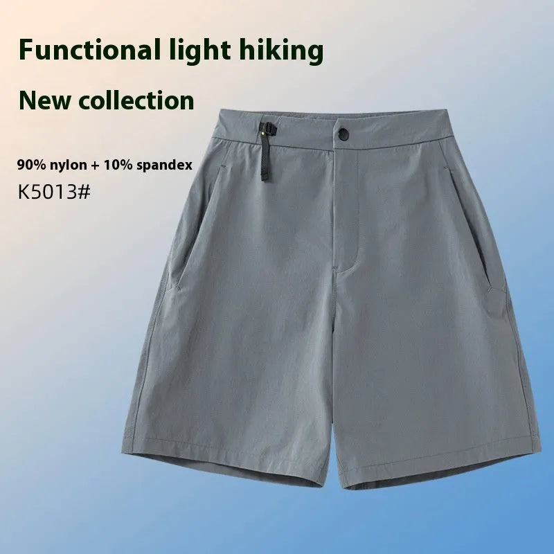 Men's solid colour sports shorts with 3D cut and stretch fabric for running.