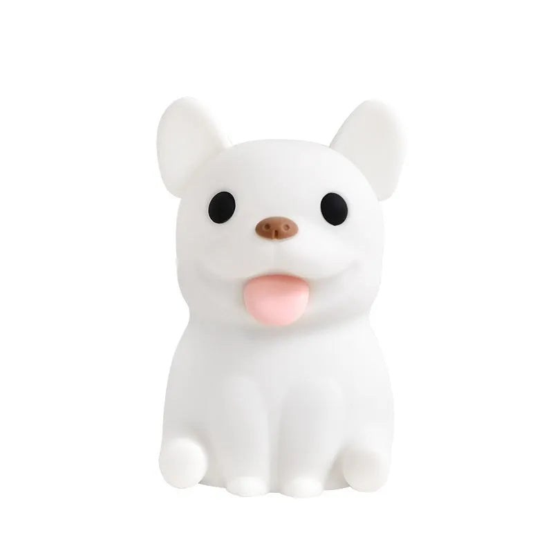 Silicone animal cartoon USB night light with Zodiac design on a bedside table.