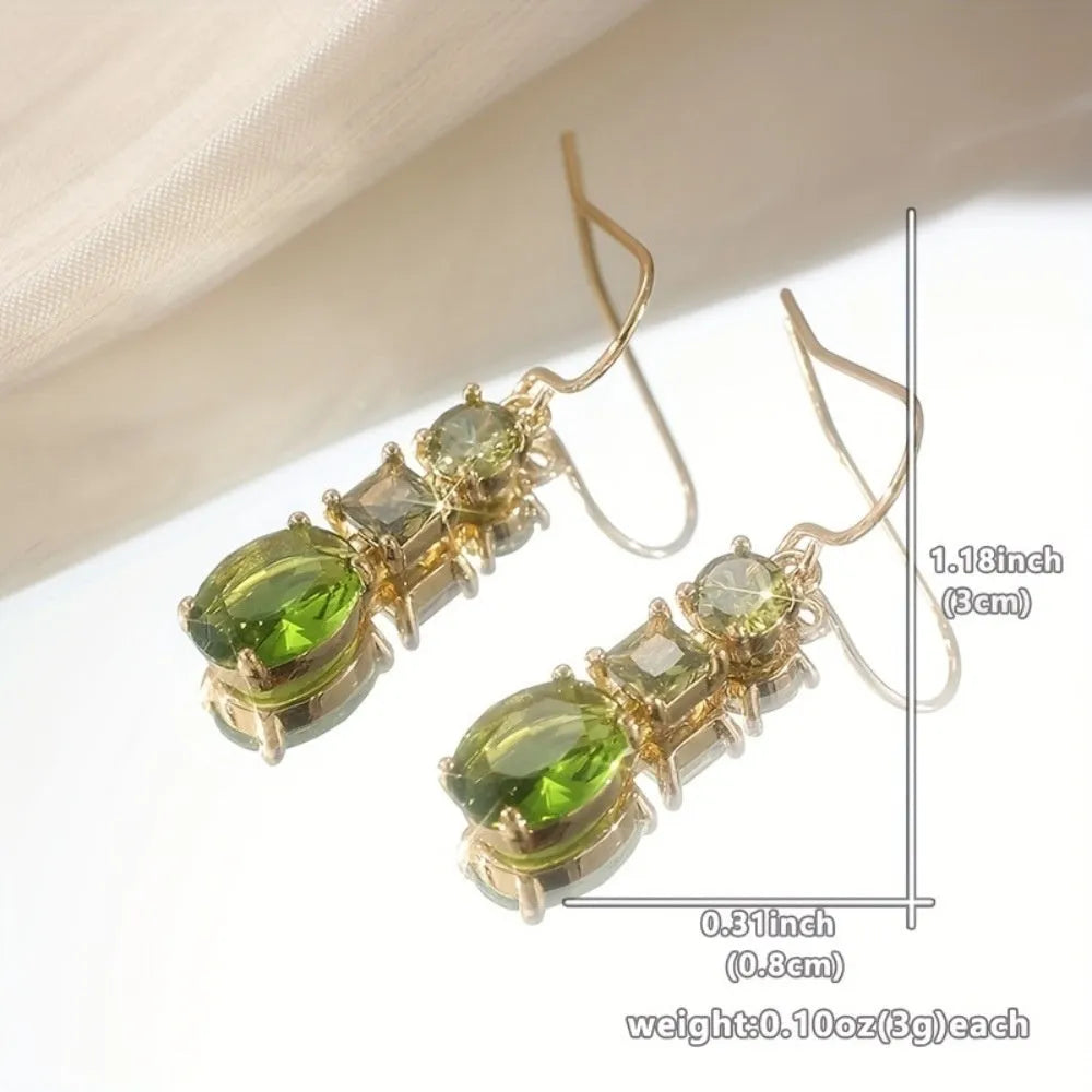 A pair of green geometric copper earrings with a quadrilateral shape and retro bohemian style.