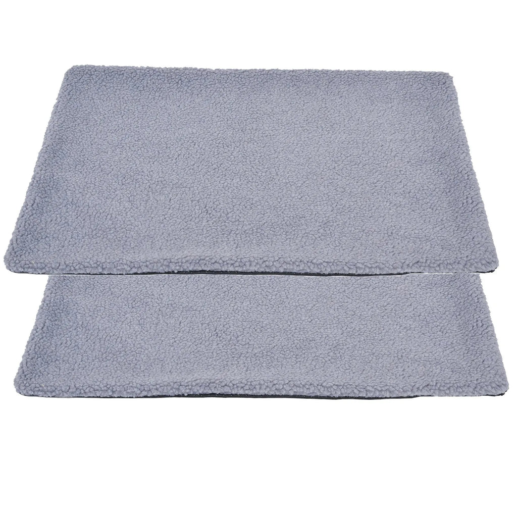 Grey plush self-heating pet pad for cats and dogs on indoor floor
