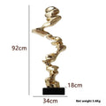 Modern abstract still life sculpture in natural resin and plastic, minimalist design on a table.