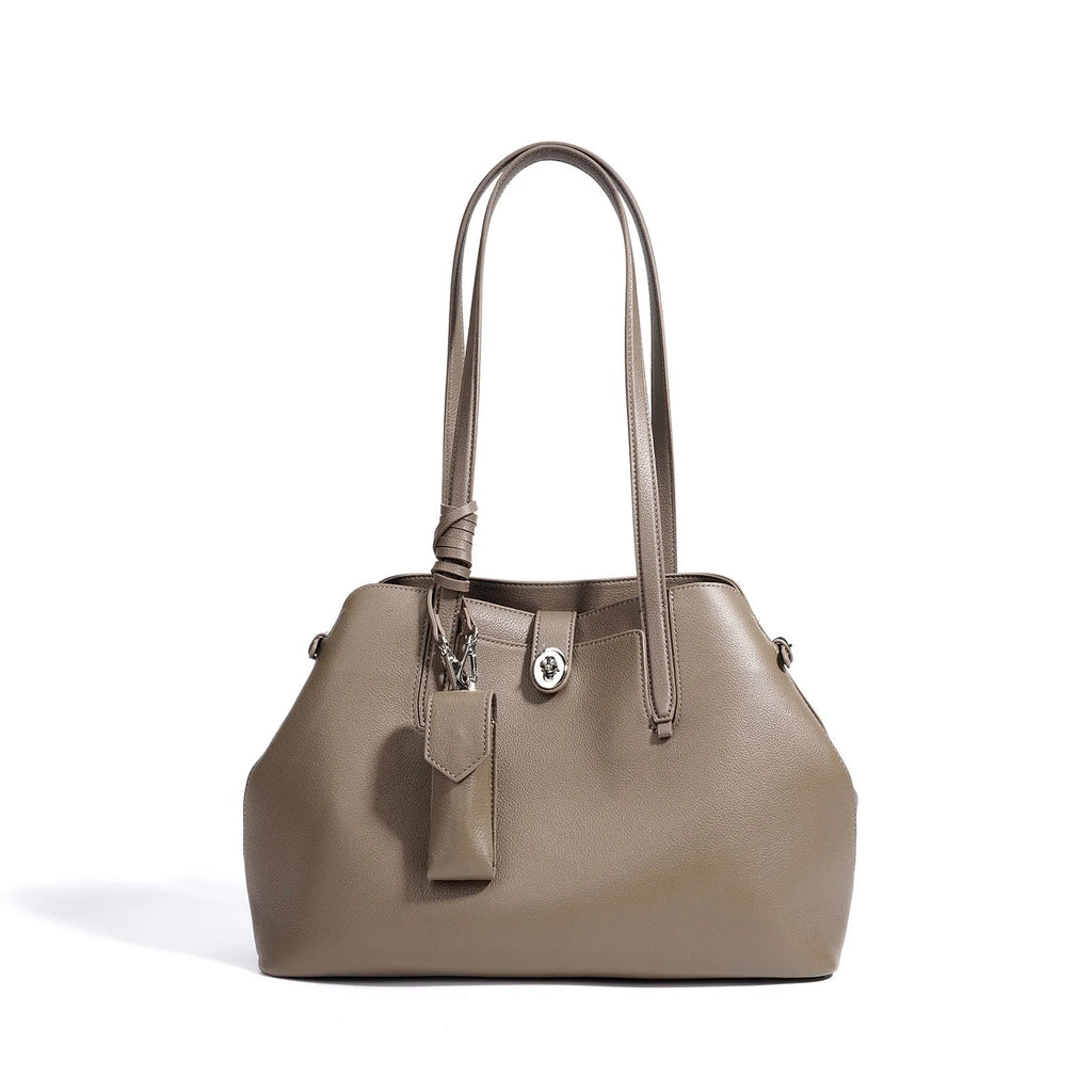 Large capacity genuine leather bucket bag for women in black with crossbody strap and patchwork detail
