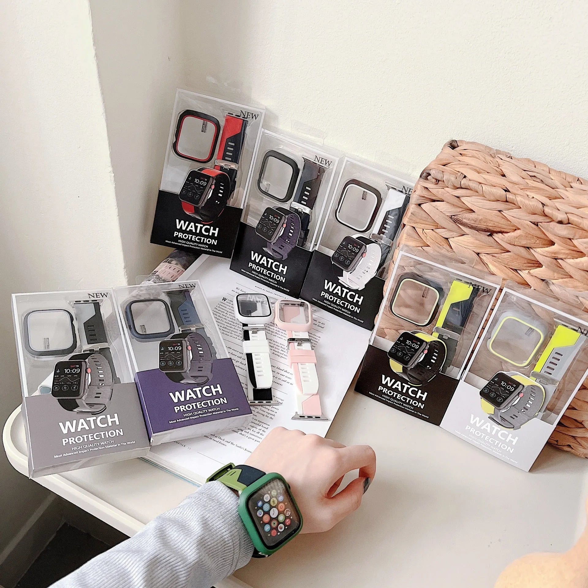 Two-tone silicone protective case for Apple Watch in black and white on a flat surface