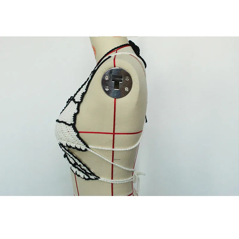 Women's black and white classic bikini swimsuit set on a mannequin.