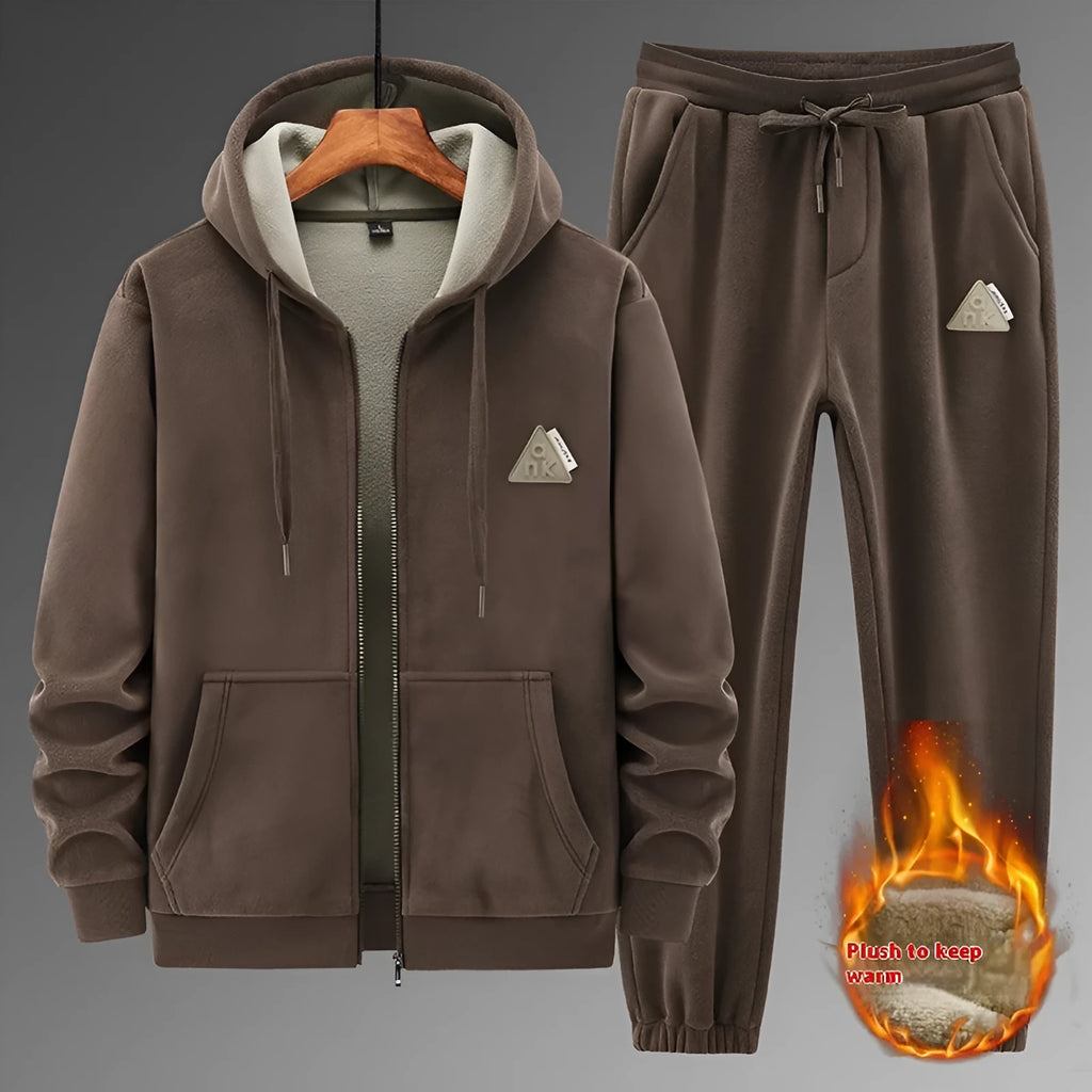 Grey men's hooded sports suit with long sleeves and full-length trousers on a neutral background.