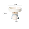 Raised ceramic cat food bowl in an animal theme design on a white background