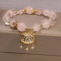 Khaki coloured crystal bracelet for women with an adjustable gold silk cord fastening.
