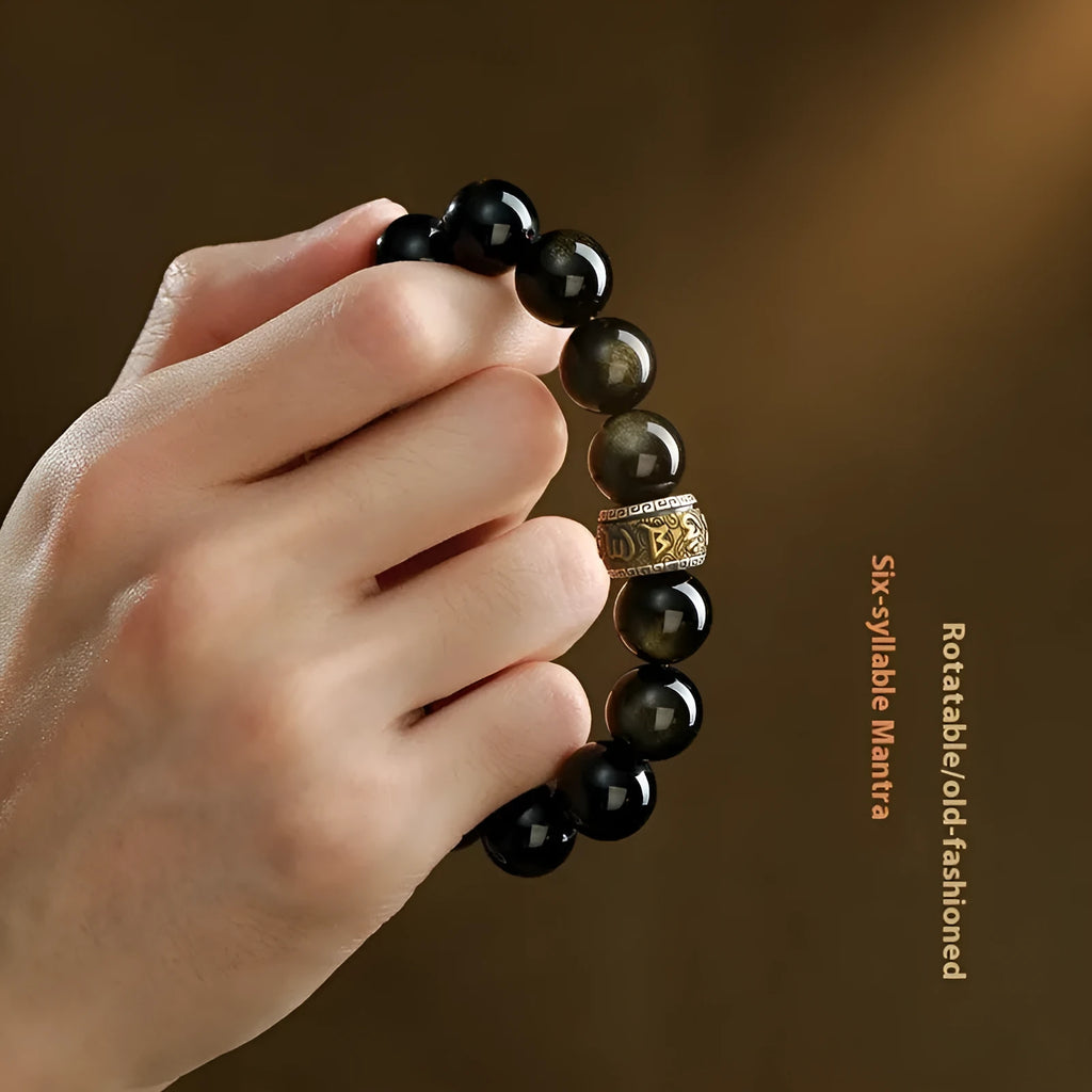 Carved cinnabar bead bracelet with animal zodiac modelling in gold obsidian and silver stone colours.