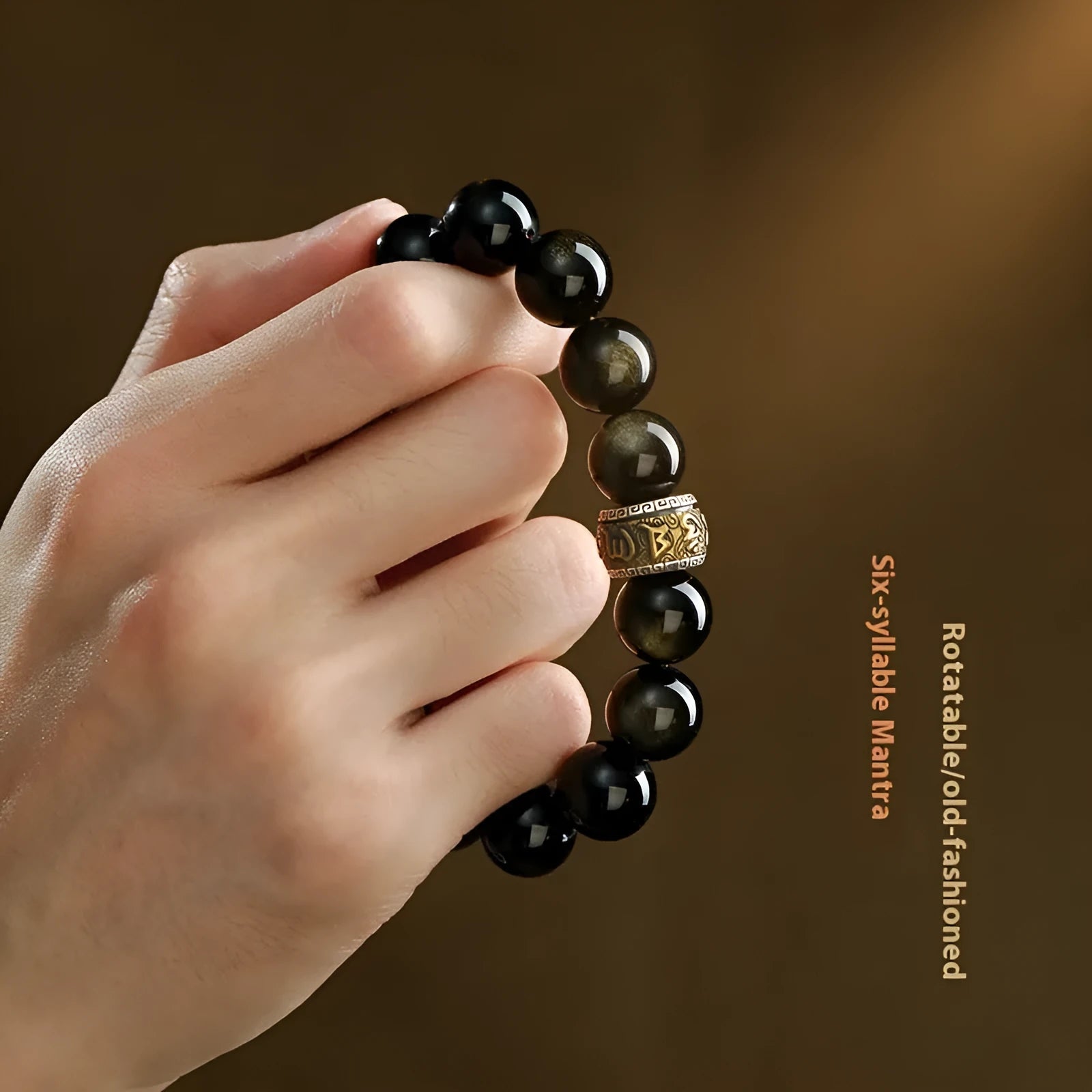 Carved cinnabar bead bracelet with animal zodiac modelling in gold obsidian and silver stone colours.