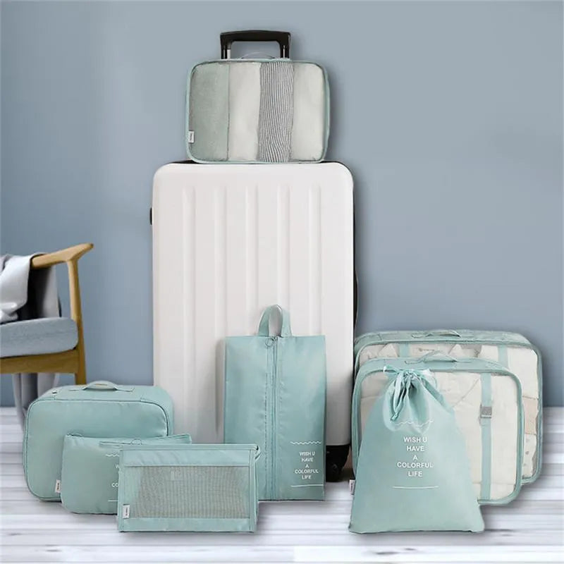 8-piece set of nylon packing cubes in assorted sizes for travel storage, featuring waterproof and dustproof material