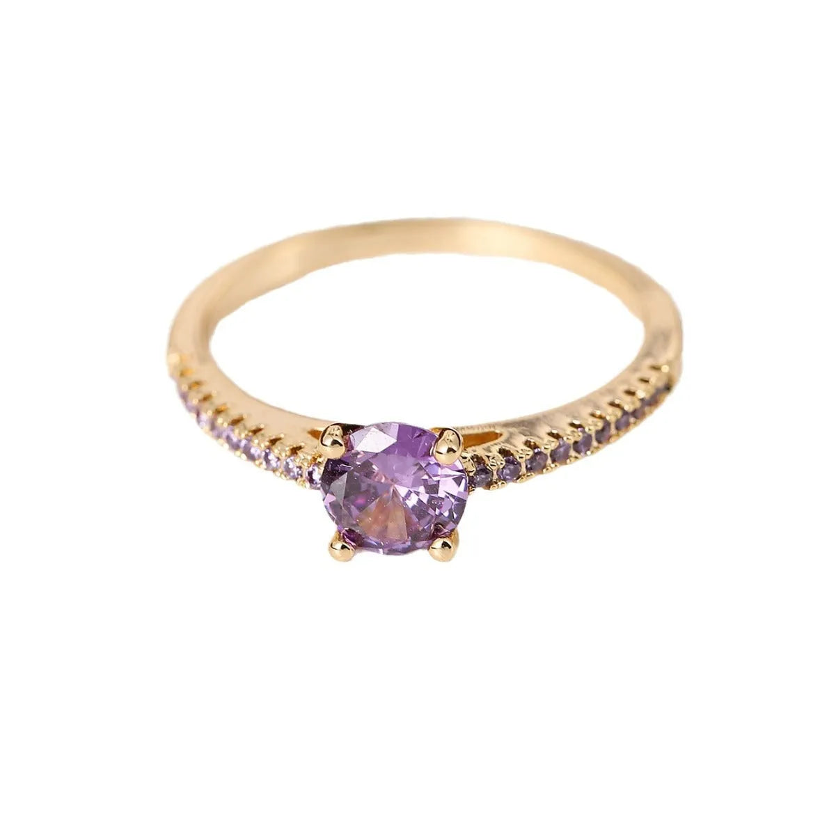 Hexagonal geometric zircon ring in copper with an electroplated gun black purple finish on a finger.
