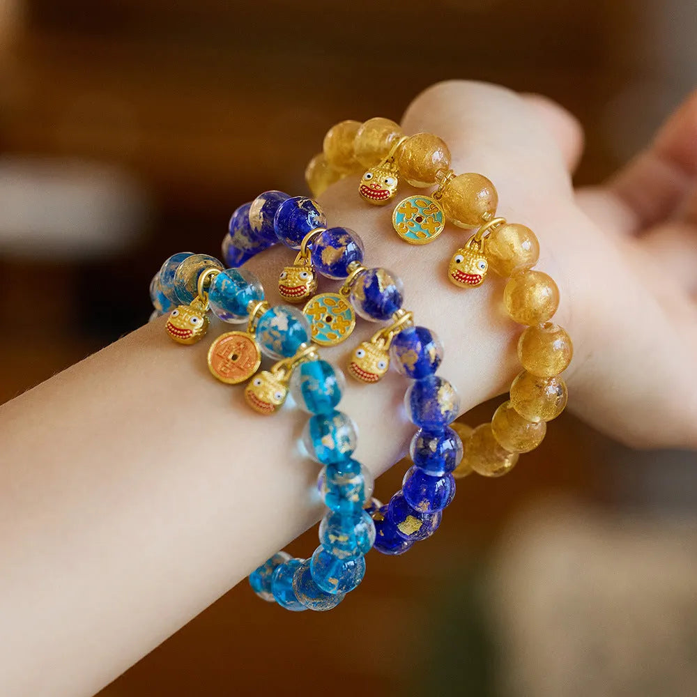 Handmade national style bracelet with gold foil coloured glaze swallowing gold beast charm