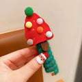 Children Christmas hair ties with red bell, green tree, khaki elk, and red tree designs on a light background