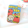 Small iron storage box with apple girl design on a white background, dimensions 9.5cm x 2.4cm x 6.5cm