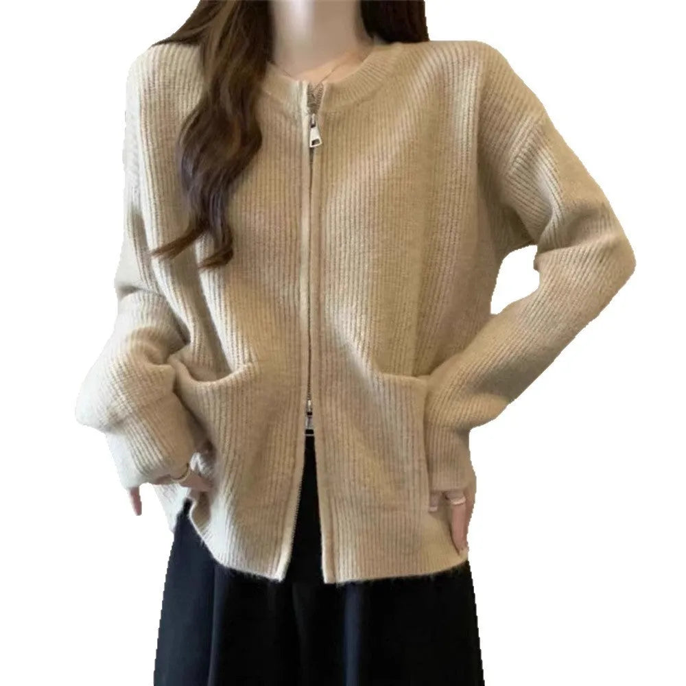 Beige temperature-sensitive viscose sweater coat, long sleeve cardigan style on a hanger.