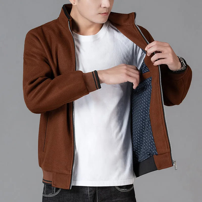 Men's grey sports-style fleece jacket with long sleeves and a side pocket.
