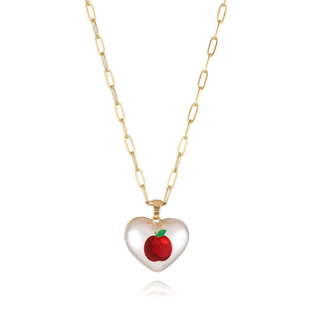 Geometric heart-shaped necklace with a detailed strawberry charm pendant on an adjustable chain.